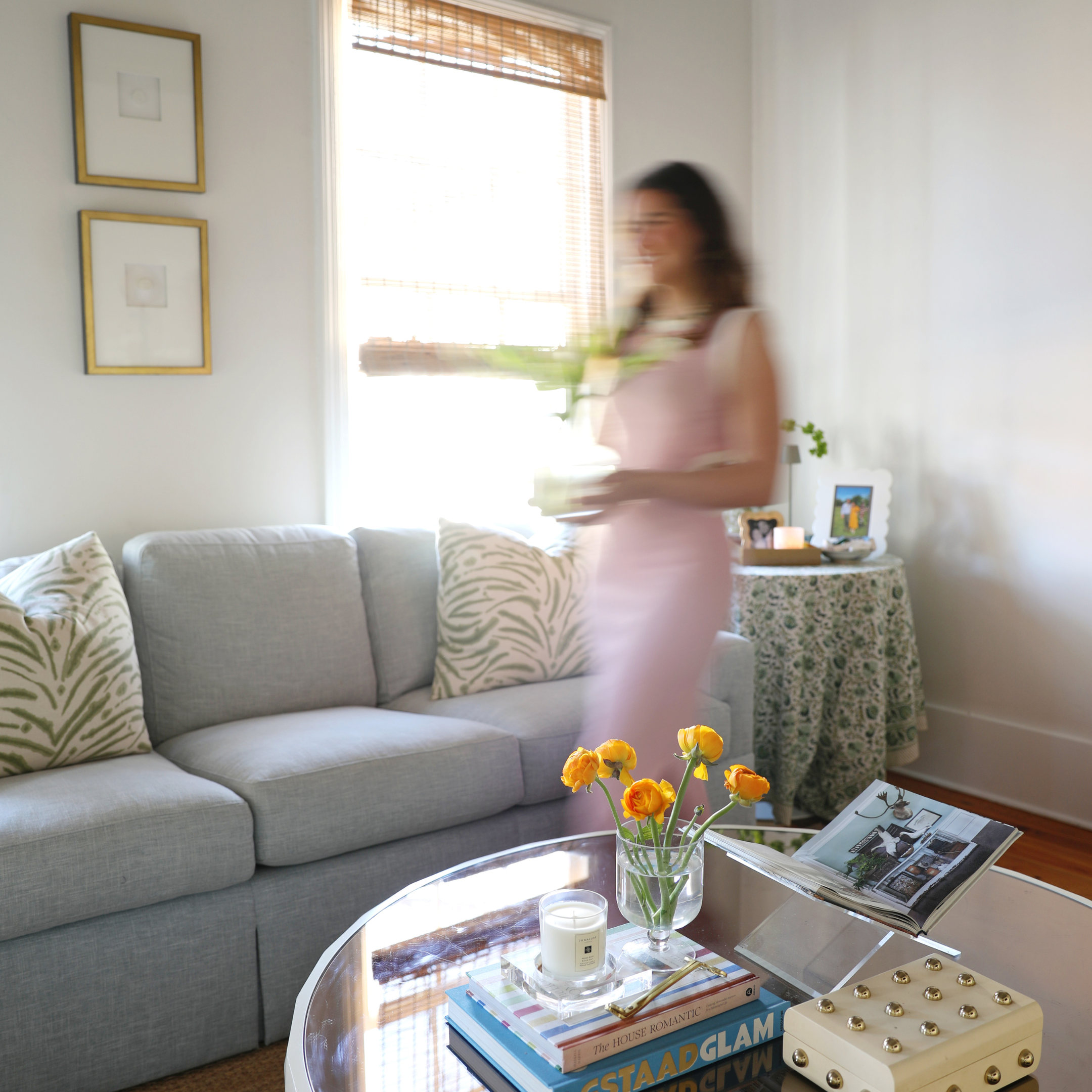 An image of Mackenzie Alala in a living room designed by Alala Home, an interior design company in Charleston and home decor shop in Mt. Pleasant.